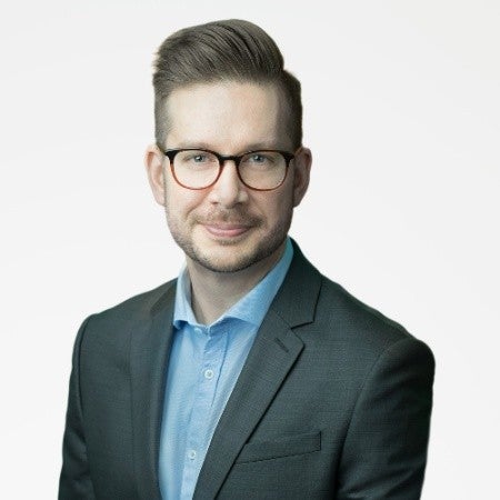 Headshot-style photo of Carlos Nai