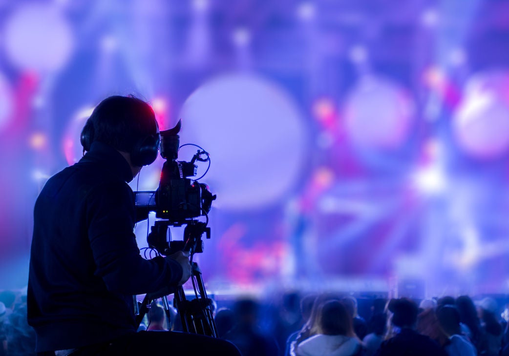 silhouette of a cameraman operator operating a camera