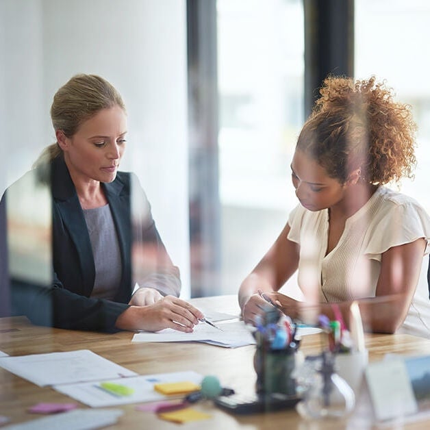 two women working together
