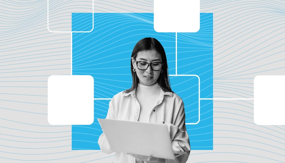 young professional looking at laptop