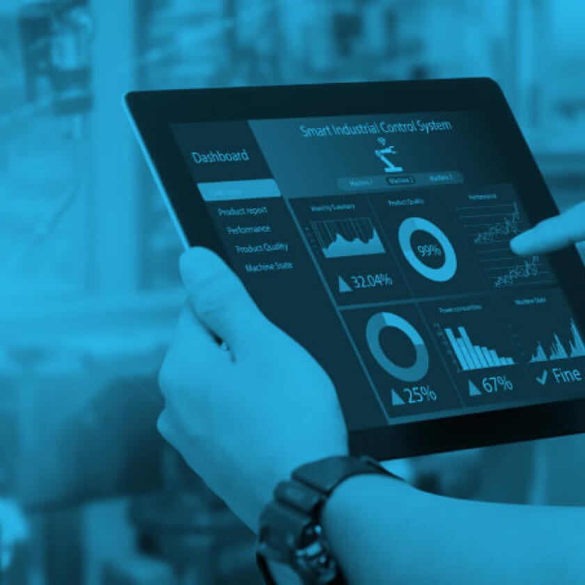 someone using tablet with data graphs on the screen