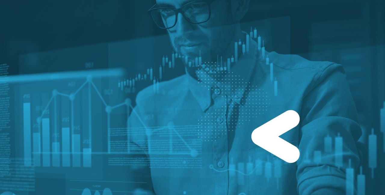 Man working on computer with blue data graphic overlay and white snowflake bug