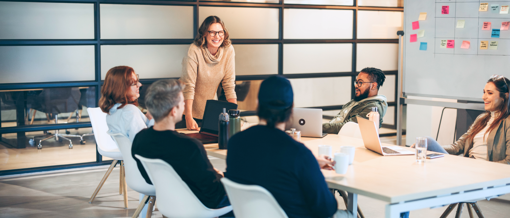 Group of colleagues working together around an office table