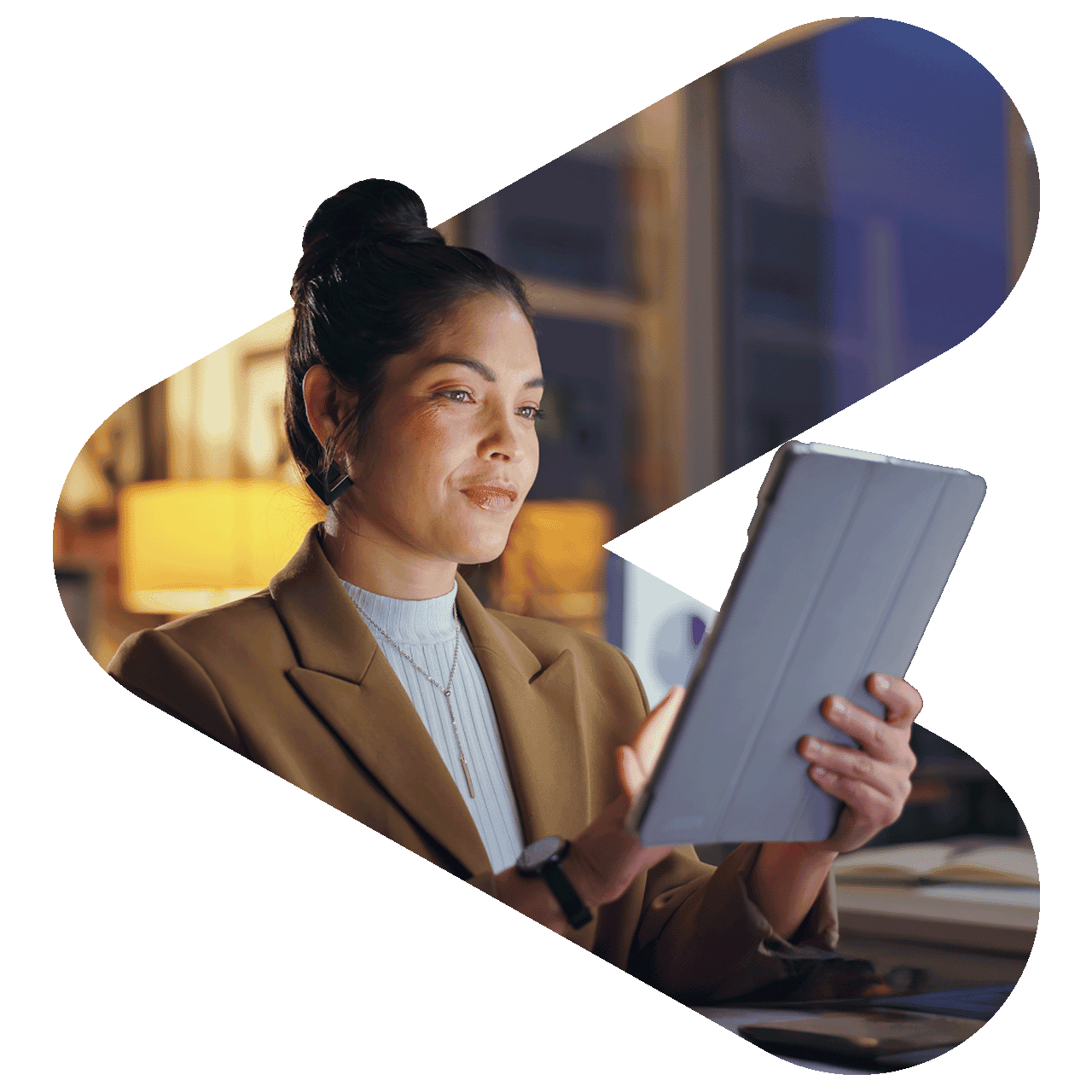 Woman in an office looking at an ipad