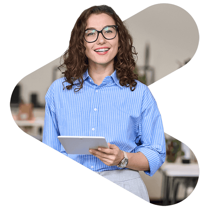 woman using tablet wearing glasses and blue shirt