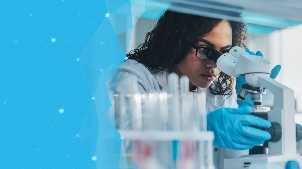 lab tech filling small bottles with medicine